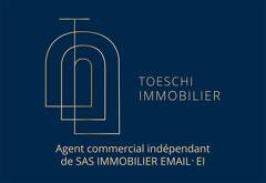 Julien Toeschi TOESCHI IMMOBILIER logo
